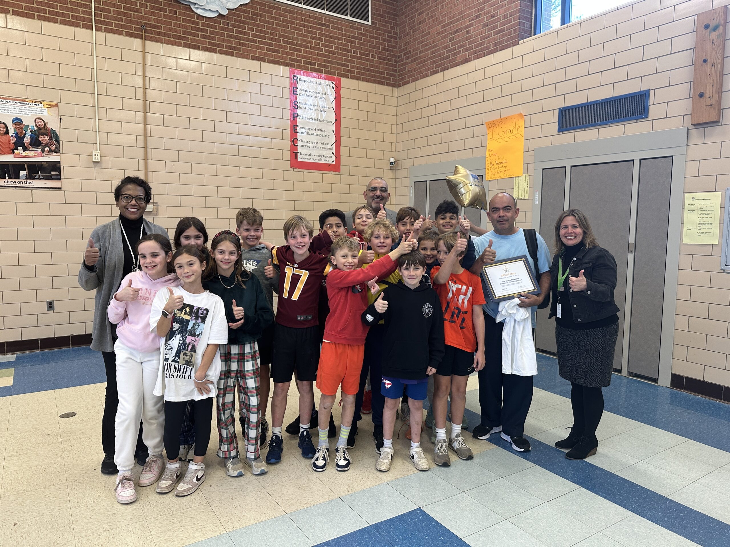 APS All Stars Picture with kids and principal in the cafeteria